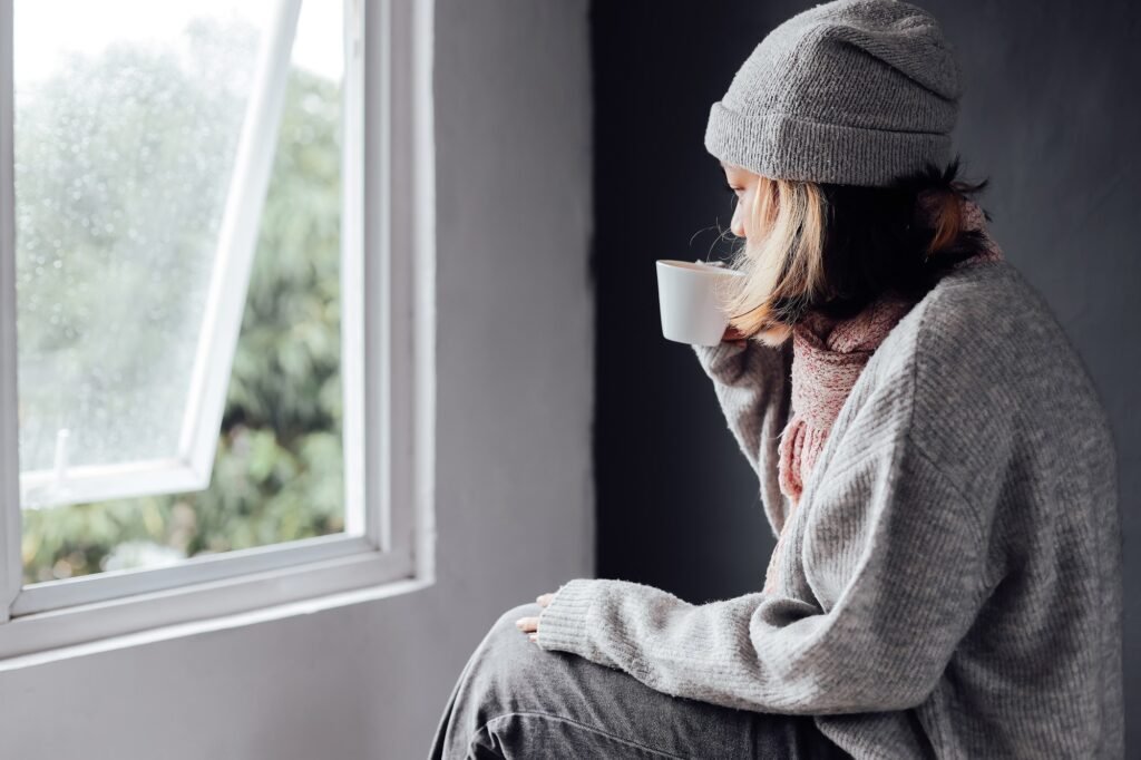 Lonely girl at home on winter