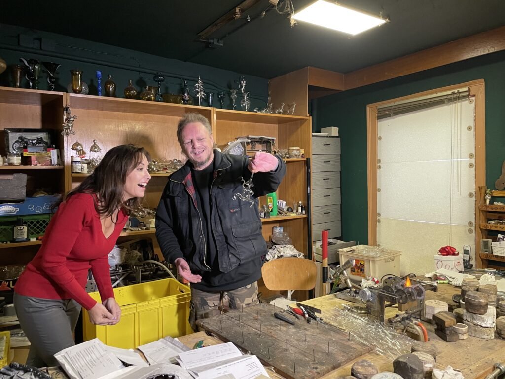 Karen with an Artisan making a Glass blown Christmas Ornament in Lauscha, Germany.