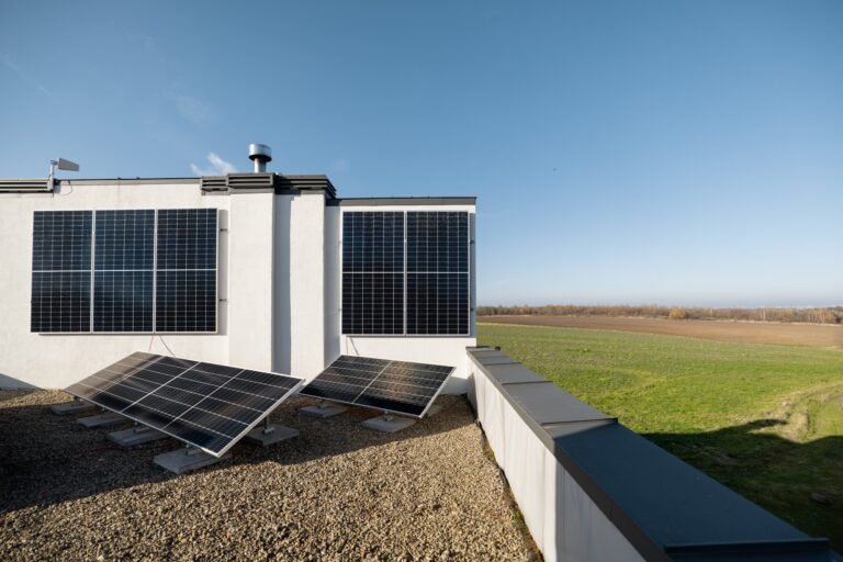 Woman on the roof of her house with a solar station