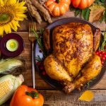 Baked chicken for Thanksgiving Day. Roasted whole chicken or turkey with autumnal vegetables