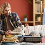 Man packing suitcase