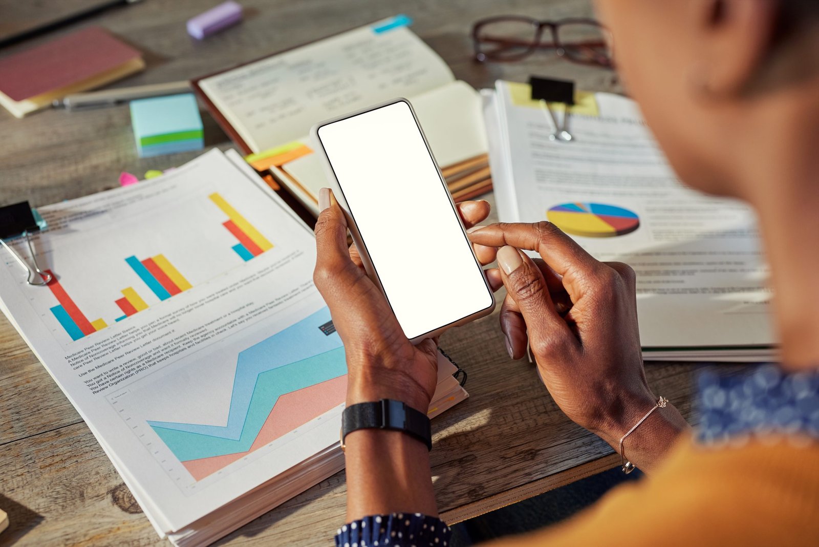 Business woman using and looking at phone