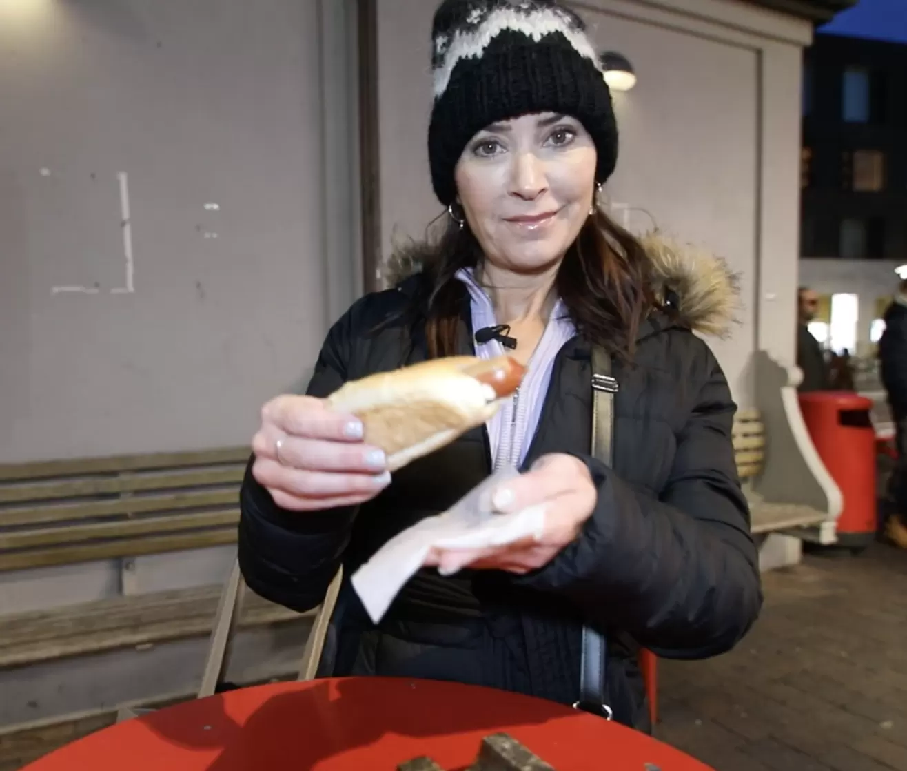Karen LeBlanc holding a hotdog.