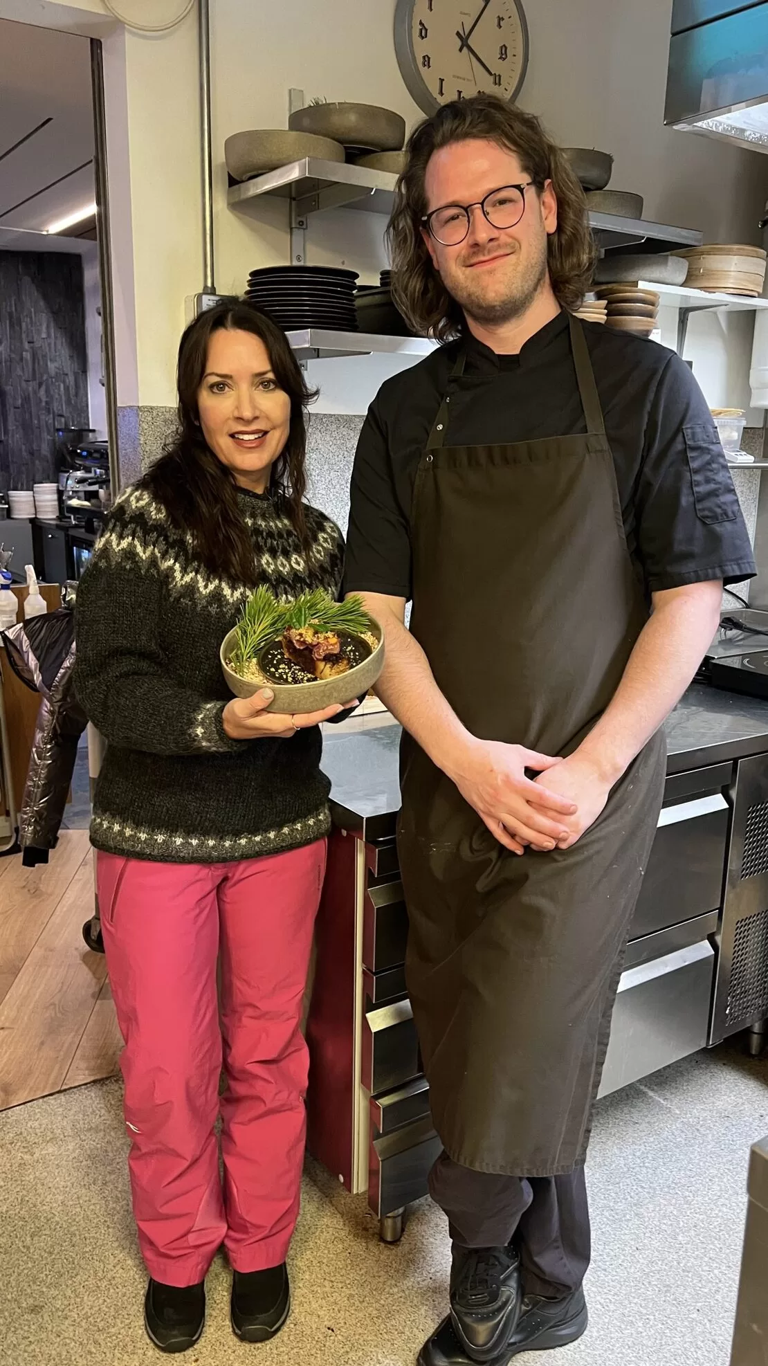 Karen LeBlanc, aka The Design Tourist & Chef Ingo at Hotel Husafell with the Chef's horsemeat dish posing for a picture.