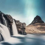 A stunning view of Kirkjufellsfoss Waterfalls and Kirkjufell with a backdrop of mezmerizing northern lights, one of things to do in West Iceland.