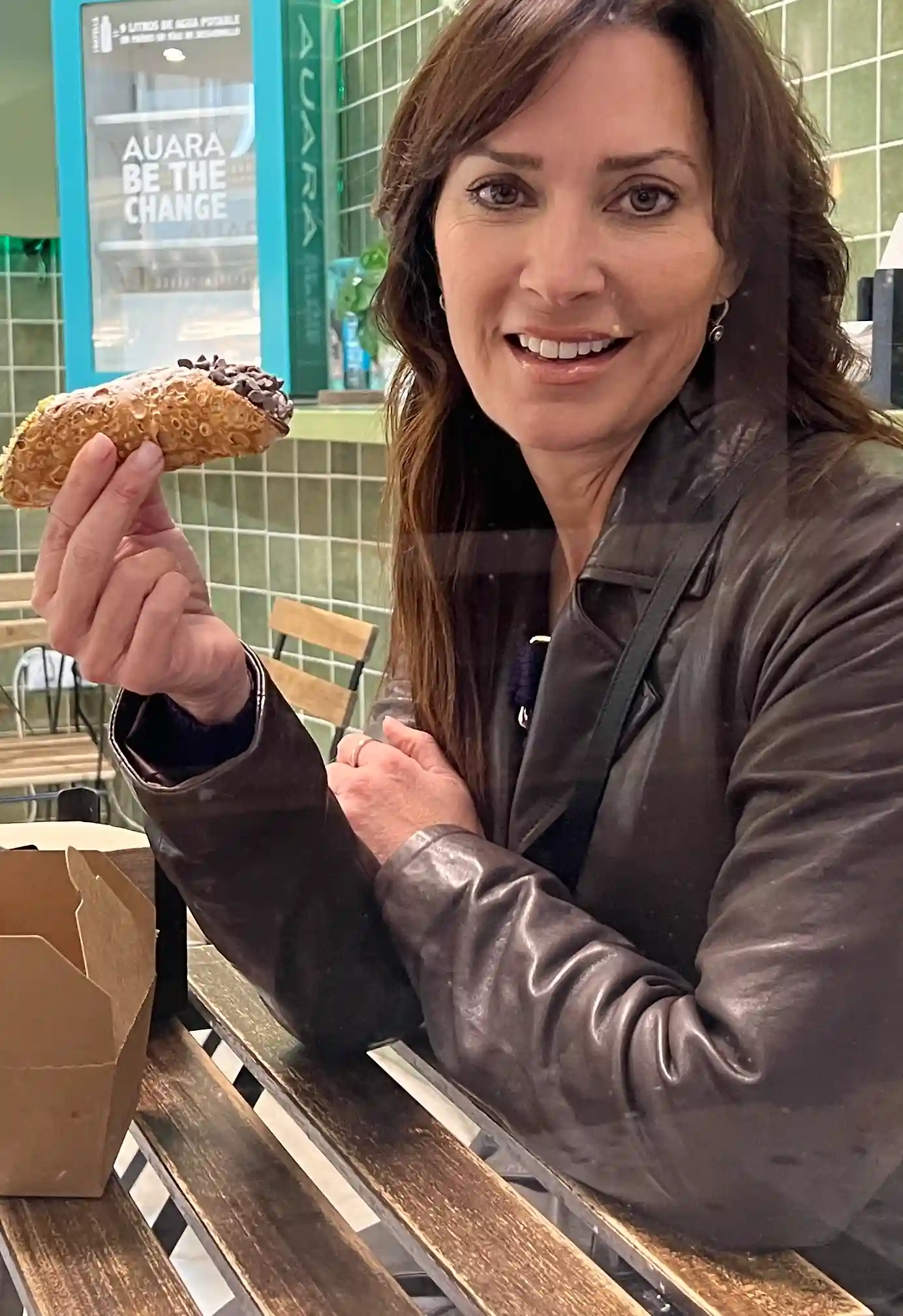 Karen holding a pastry Cannoli
