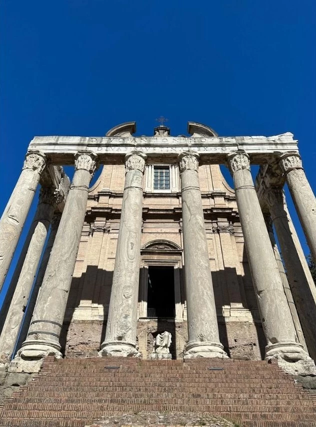 Five Free Things To See in Rome in a Day The Temple of Antoninus and Faustina building with columns and a statue.