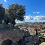 Rome city with trees and a bridge view from top of the Hill.