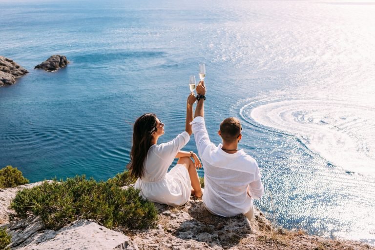 A couple in love celebrates their engagement on the seashore