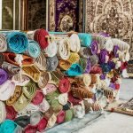 Heap of rolled up rugs in rug store