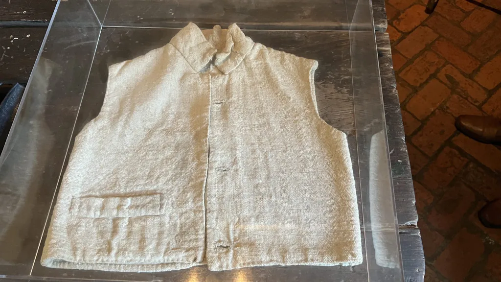 A photo of a Child Slave Vest in the museum.