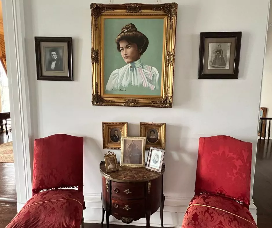 a framed picture of a woman on a wall of Nottoway Mansion