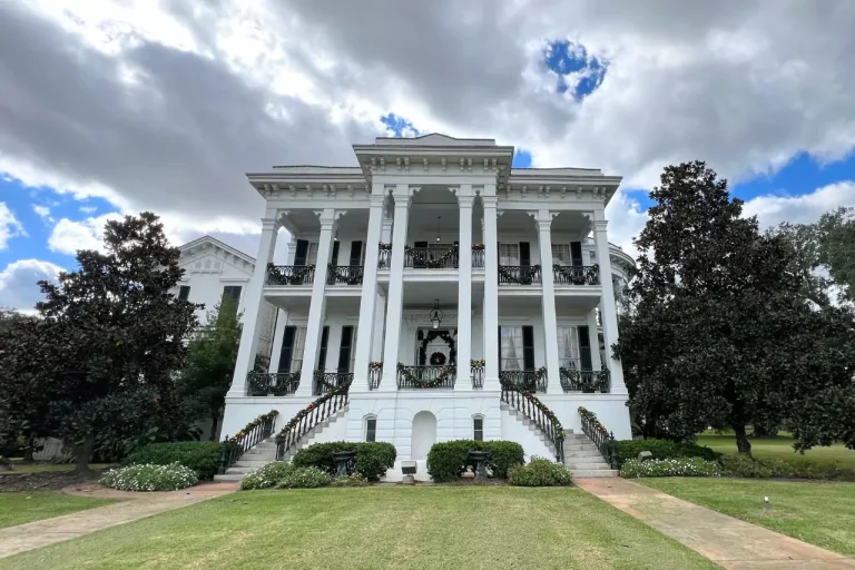 Nottoway Mansion with columns and a lawn