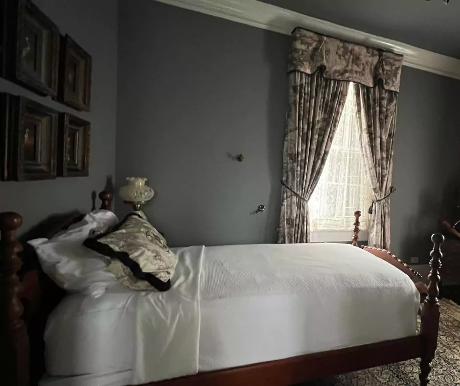 a bed in a room of Nottoway Mansion