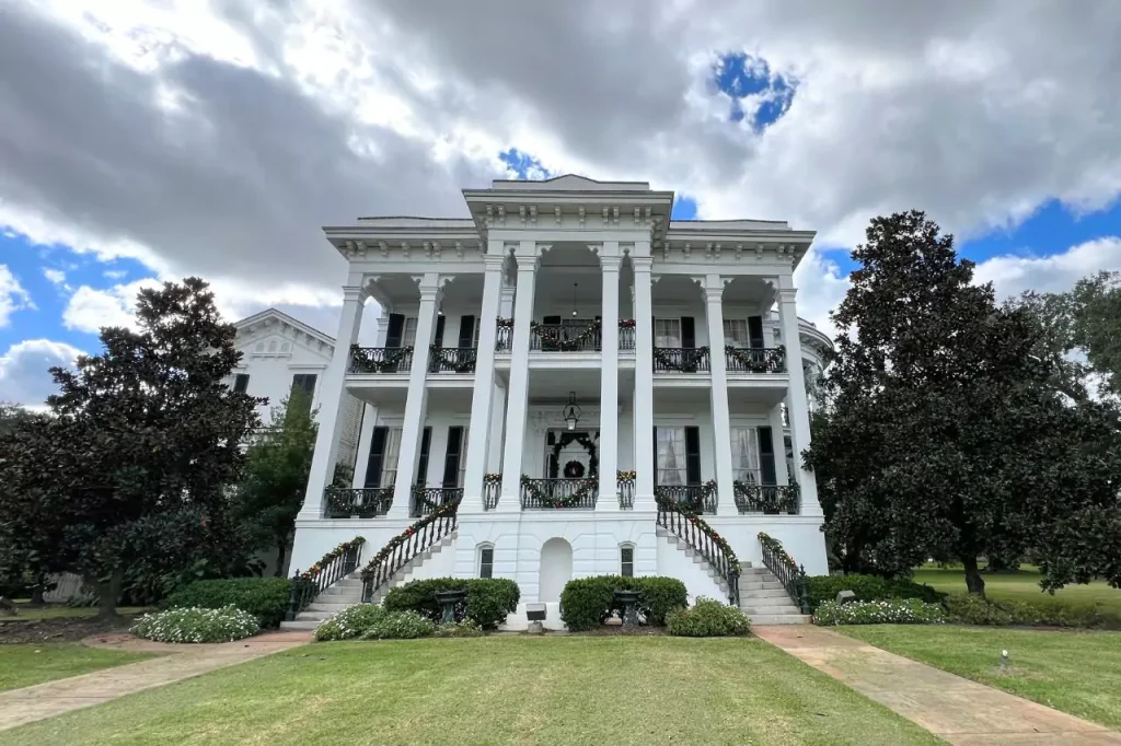 Nottoway Mansion with columns and a lawn