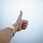 a hand with a thumb up