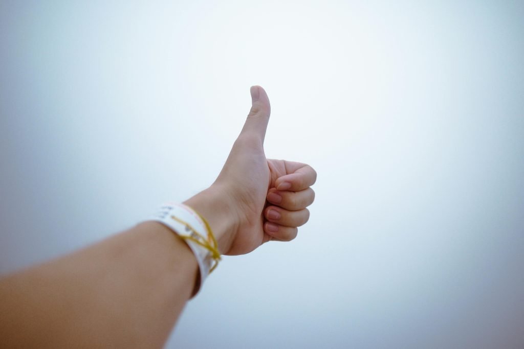 a hand with a thumb up