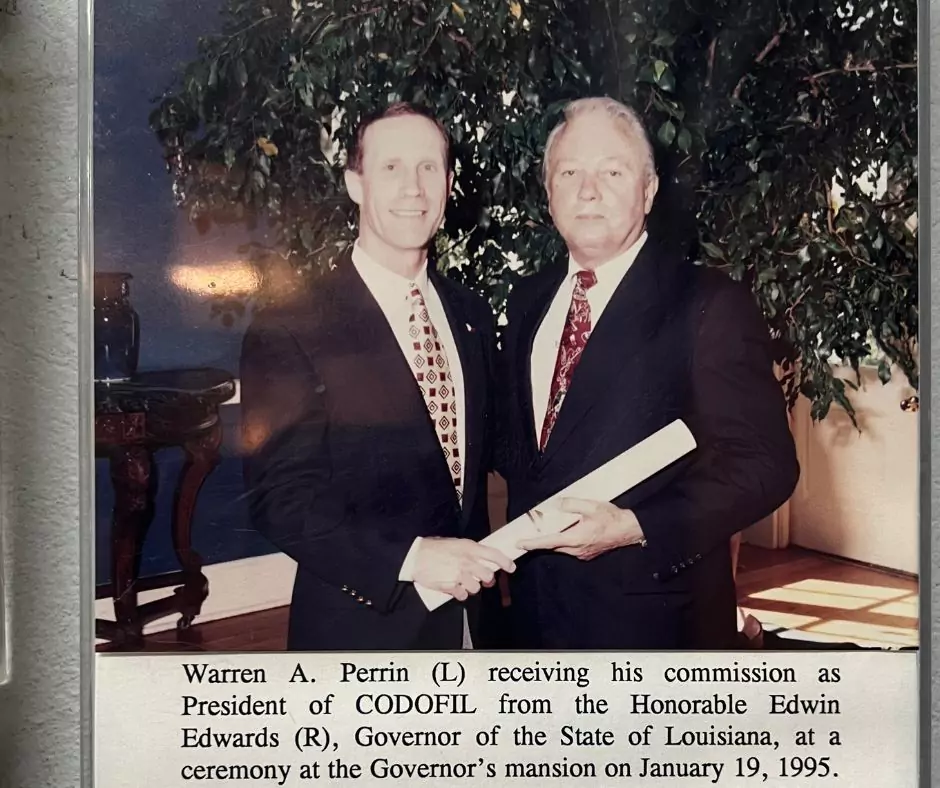 Warren A Perrin (L) receiving his commission as President of CODOFIL from Honorable Edwin Edwards (R).