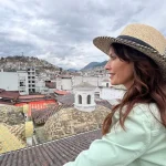 Karen overlooking the city of Quito while she explore Ecuador on a Hero's Journey through Arts and Culture.