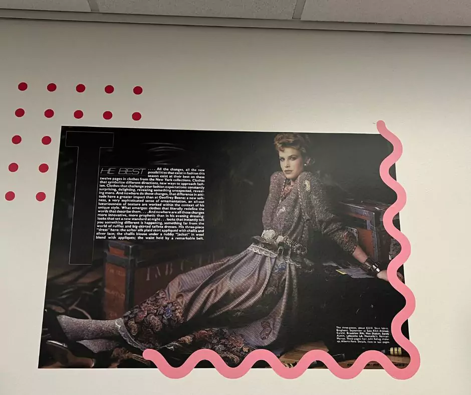 A museum wall display featuring a vintage Geoffrey Beene fashion editorial with a model in an opulent embroidered outfit, accompanied by text discussing Beene’s innovative approach to fashion design.