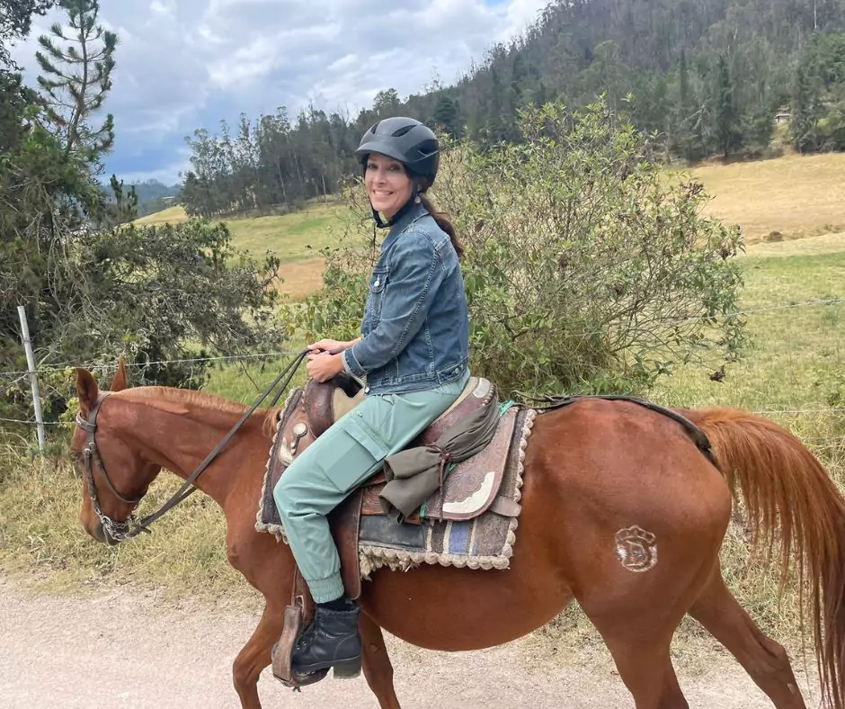 a woman riding a horse