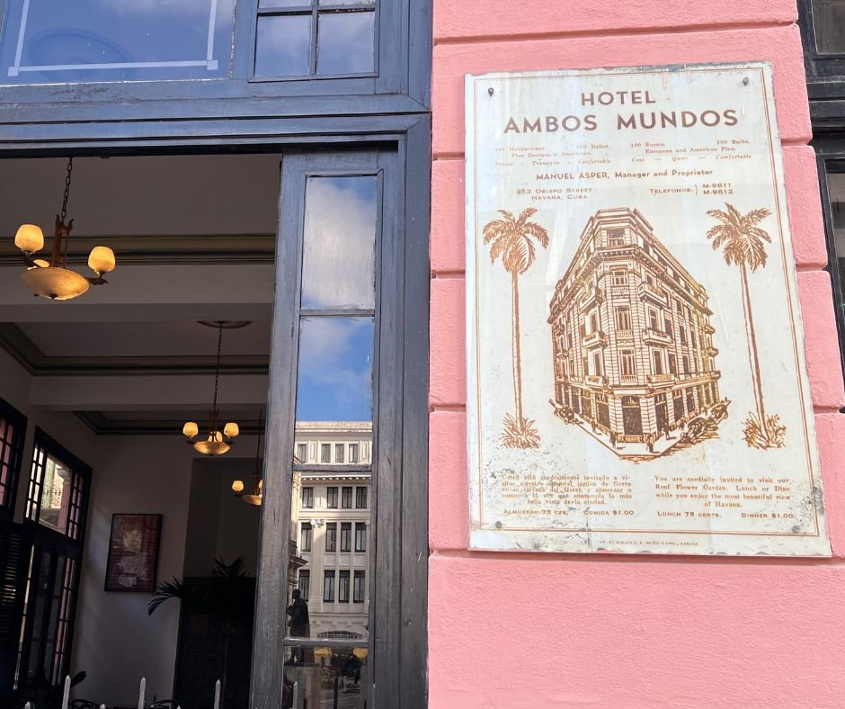 Hotel Ambos Mundos plaque – A vintage sign on the hotel’s pink facade, displaying an illustration of the building and historical details.