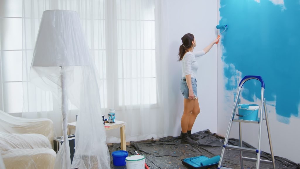 Caucasian woman redecorating