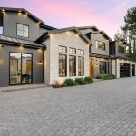 Modern luxury home exterior at sunset.