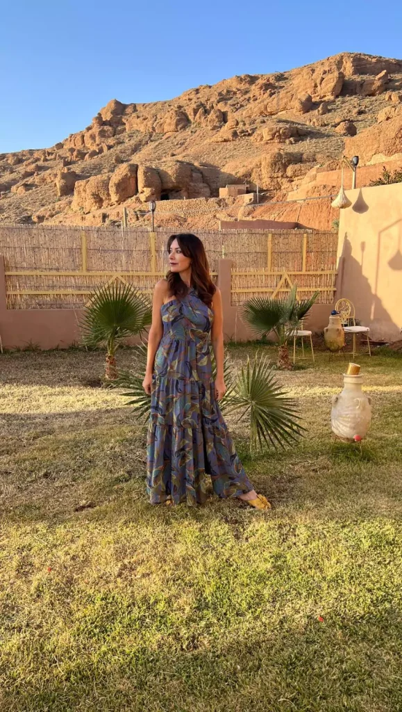Karen wearingwist halter maxi dress at Riad Sahara Star in the Atlas Mountains