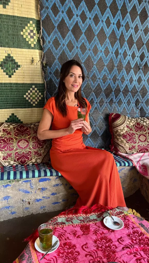 Karen wore an orange casual knit two-piece set while visiting the Berber village of Ourika in Morocco.