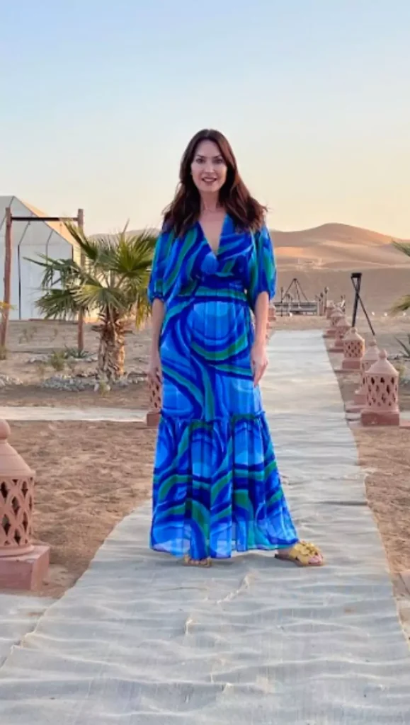 Karen wearing a blue dress and a yellow sandal in Morocco