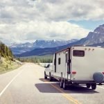 Caravan or motor home trailer on a mountain road