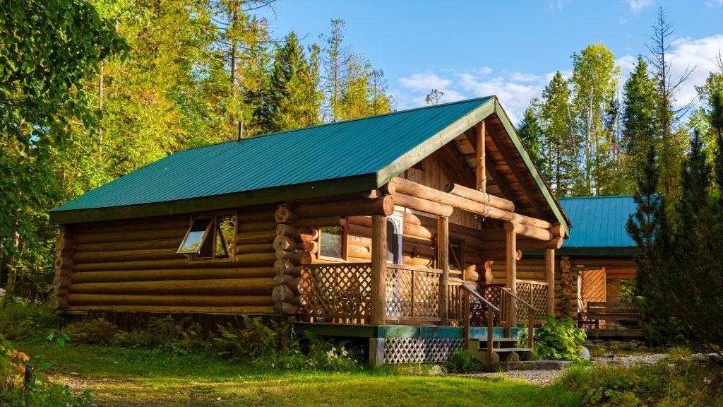 Wooden hut in an autumn forest , cabin off grid , wooden cabin woods British Colombia Canada Autumn