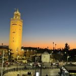 Sunset view of Koutoubia Mosque and city lights during 2 days in Marrakech, capturing the golden hour and evening atmosphere near the Medina.
