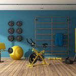 Blue home gym with black and yellow fitness equipment