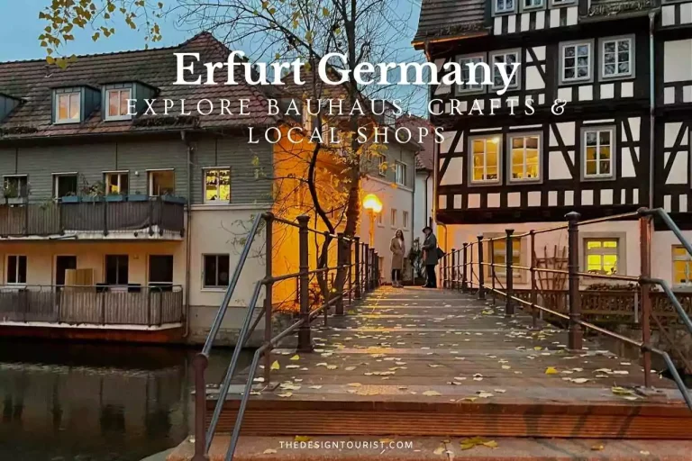 Evening view of the historic Krämerbrücke in Erfurt, Germany, featuring timber-framed buildings, autumn leaves on a wooden pedestrian bridge, and warm glowing lights from artisan shops — promoting Bauhaus design, local crafts, and handmade traditions.