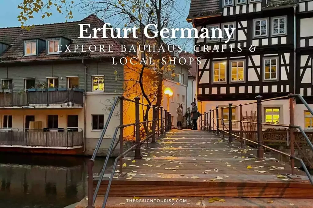 Evening view of the historic Krämerbrücke in Erfurt, Germany, featuring timber-framed buildings, autumn leaves on a wooden pedestrian bridge, and warm glowing lights from artisan shops — promoting Bauhaus design, local crafts, and handmade traditions.