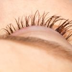 female eye with eyelashes. eyelash extension and removal concept