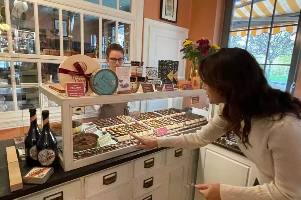 Karen LeBlanc samples handcrafted pralines at Goldhelm Schokolade’s counter in Erfurt, Germany.