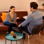 Nice serious pleasant woman visiting a psychologist
