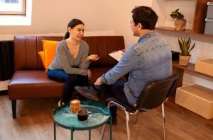 Nice serious pleasant woman visiting a psychologist