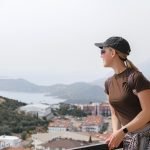 woman enjoying solo mindful travel scenic mountain eco tourism,hiking,digital detox,conscious living