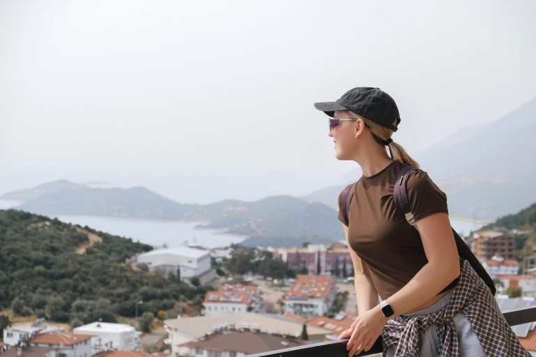 woman enjoying solo mindful travel scenic mountain eco tourism,hiking,digital detox,conscious living