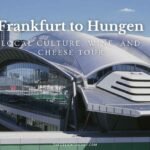 Modern glass and steel architecture at Frankfurt Airport with city skyline reflection, illustrating the starting point of a cultural and culinary journey from Frankfurt to Hungen.