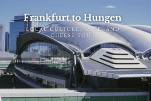 Modern glass and steel architecture at Frankfurt Airport with city skyline reflection, illustrating the starting point of a cultural and culinary journey from Frankfurt to Hungen.