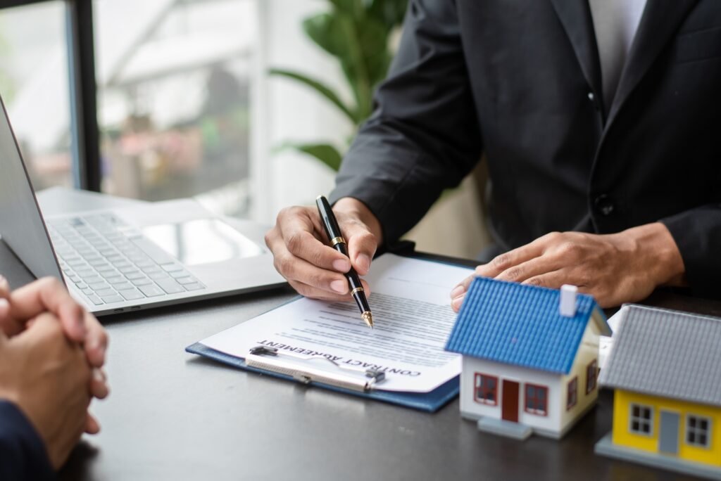 Considering buying a home, investing in real estate. Broker signs a sales agreement. agent,