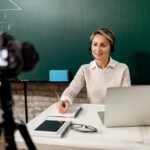 Elementary school teacher teaching student online during coronavirus epidemic.