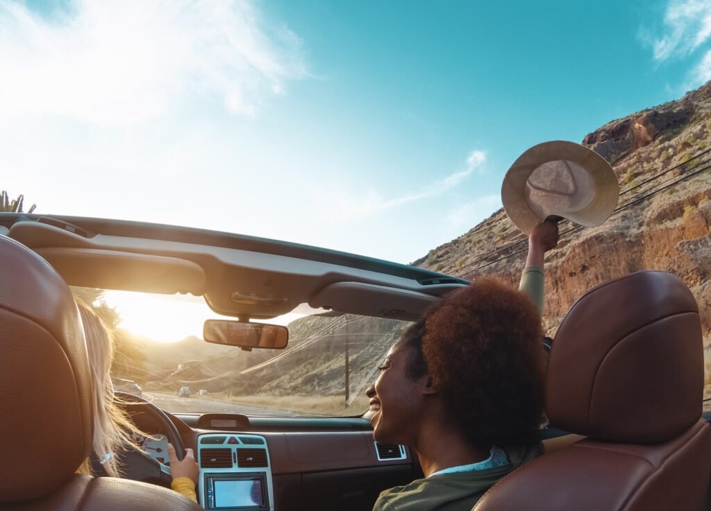 Young women doing road trip in tropical city