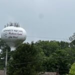 Water tower in Kennett Square, Pennsylvania with the phrase "Mushroom Capital of the World" written on it.