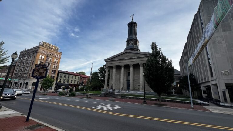 Historic downtown Harrisburg featuring the Greek Revival-style Dauphin County Courthouse with its tall clock tower, surrounded by classic buildings along the street. Top Things to Do in West Chester, Pennsylvania